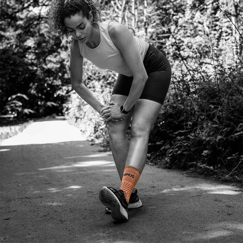 Woman stretching wearing a Bearhug ankle support