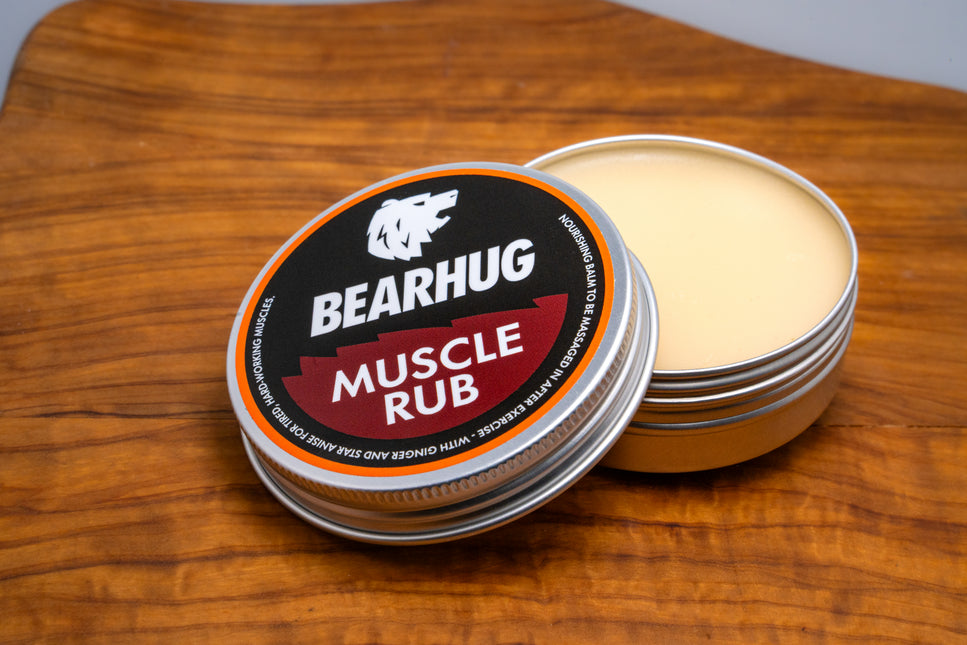 Bearhug Muscle Rub 60g tin angled view, dark red label