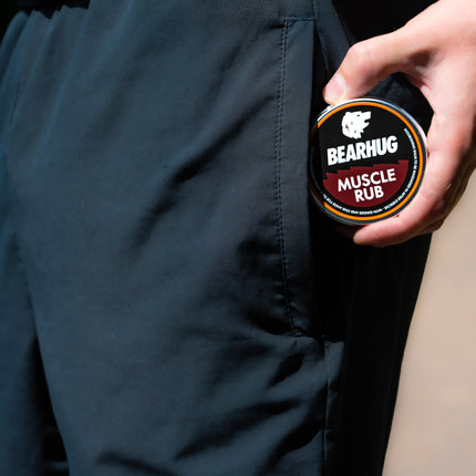 Massaging Bearhug Muscle Rub into tired muscles after exercise