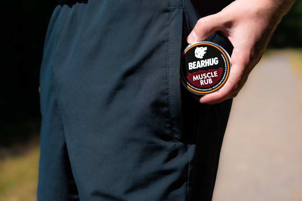 Massaging Bearhug Muscle Rub into tired muscles after exercise